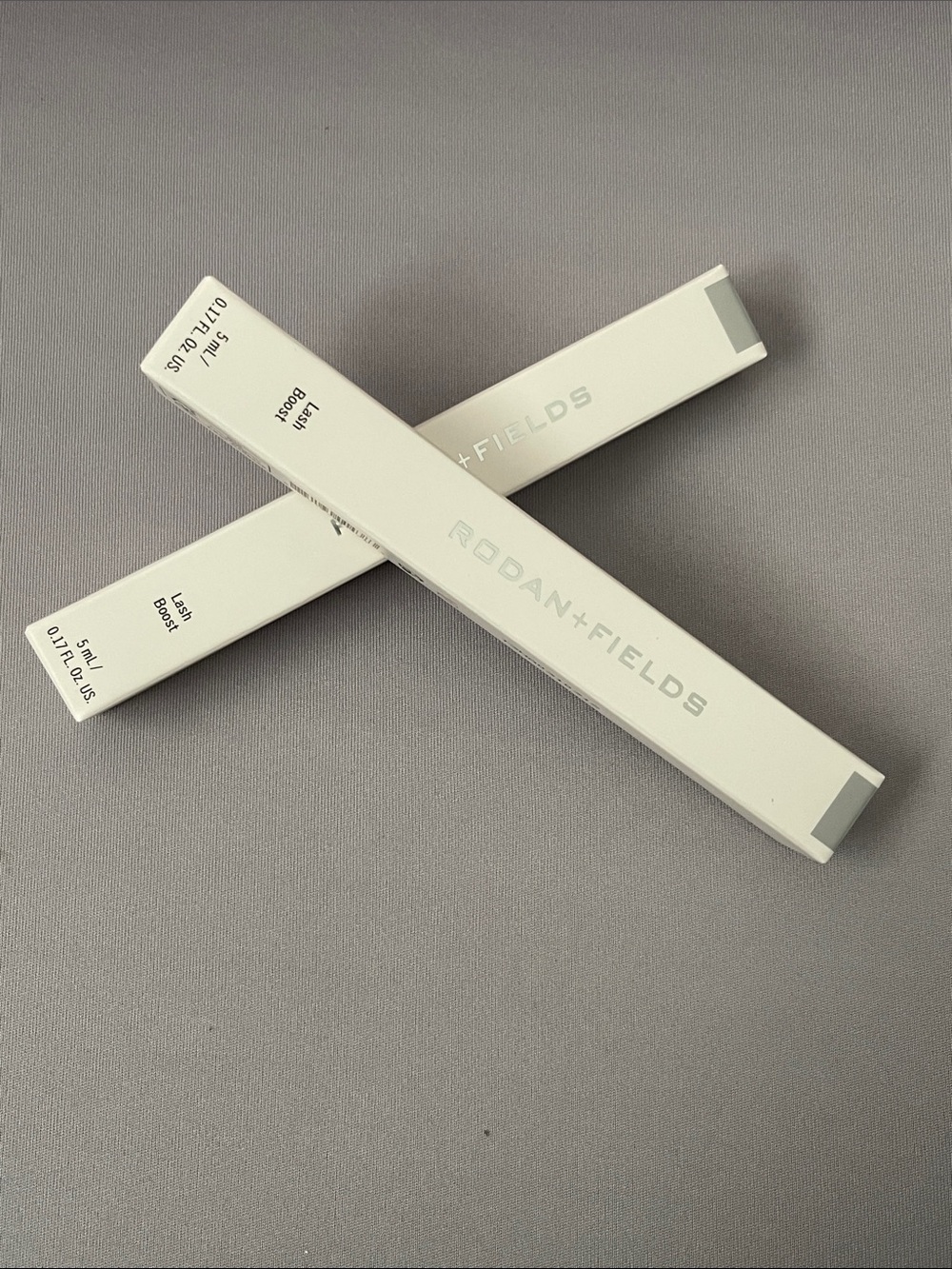 Rodan + Fields Lash Boost Serum – White and Light Gray Packaging